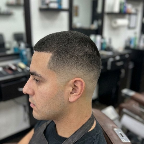 4 Guard Buzz Cut Mid Taper for a Polished and Low Maintenance Style
