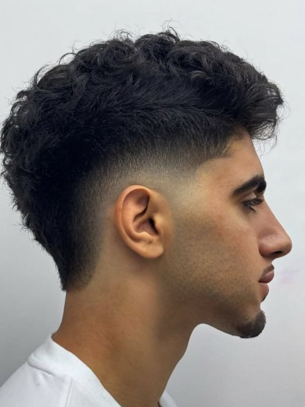 Wavy Low Taper Fade Modern Mullet Haircut