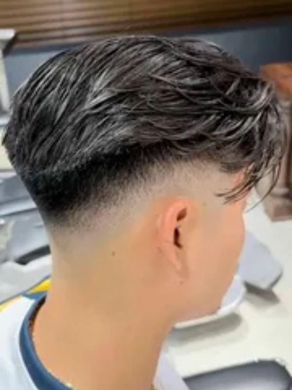 Low Taper Fade Middle Part with Textured Top
