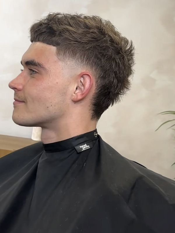 Low Taper Fade Modern Mullet for Thick Hair